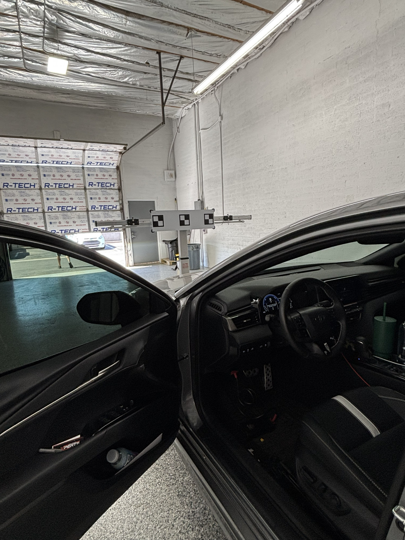 Vehicle positioned for ADAS camera calibration inside the PRO-CAL Tempe shop